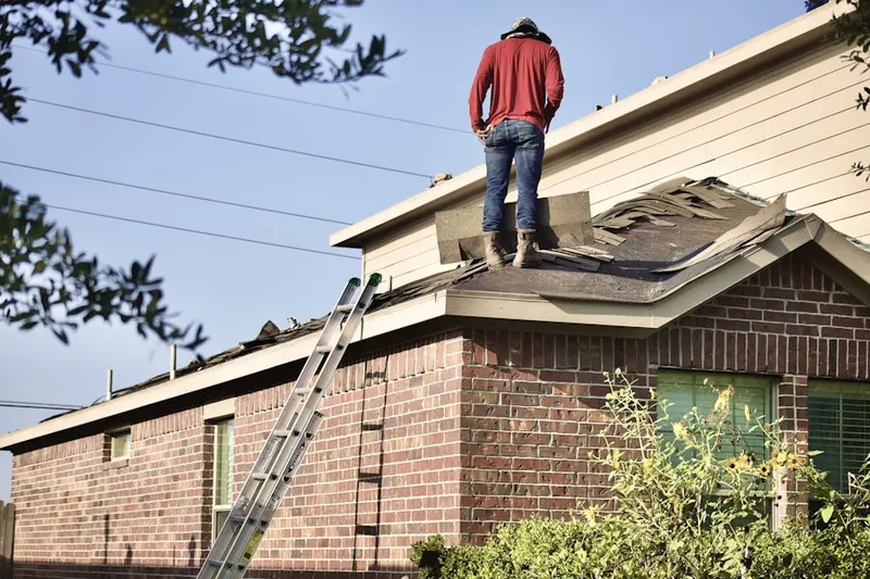 Professional roofer working on a residential roof in Doral Park